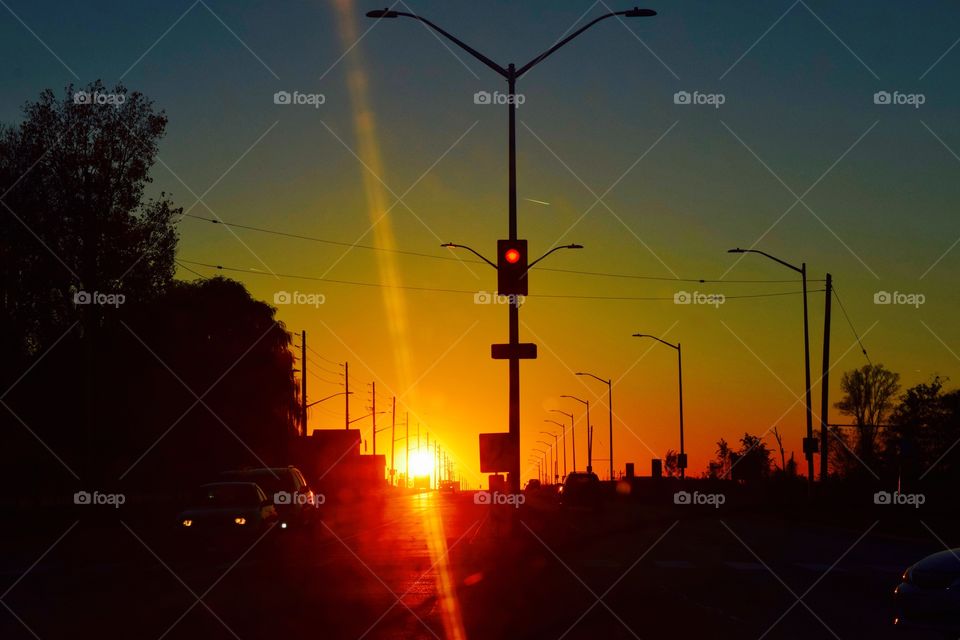 View of car on street at sunset