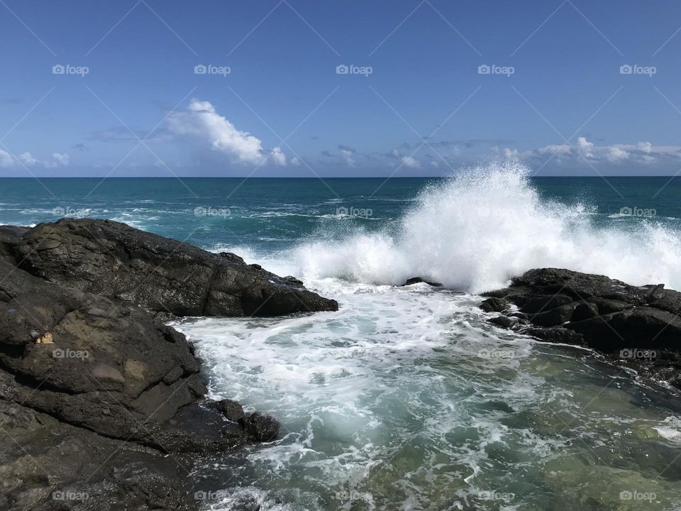 Waves crashing on rocks