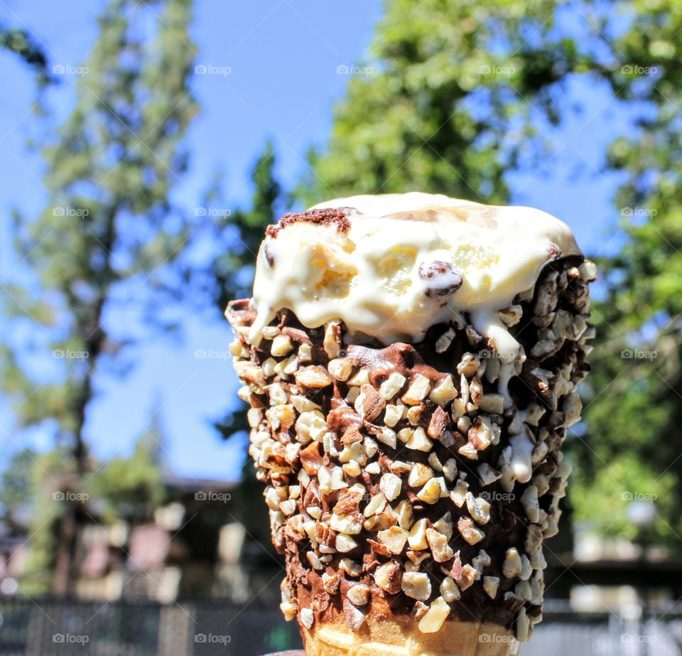 deliciously melting ice cream on a waffle cone