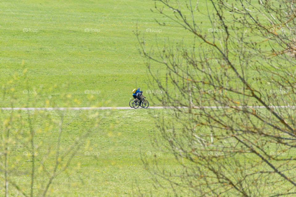 two cyclists on their bikes on tour in the countryside
