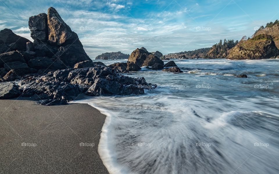 Surf at rocky beach