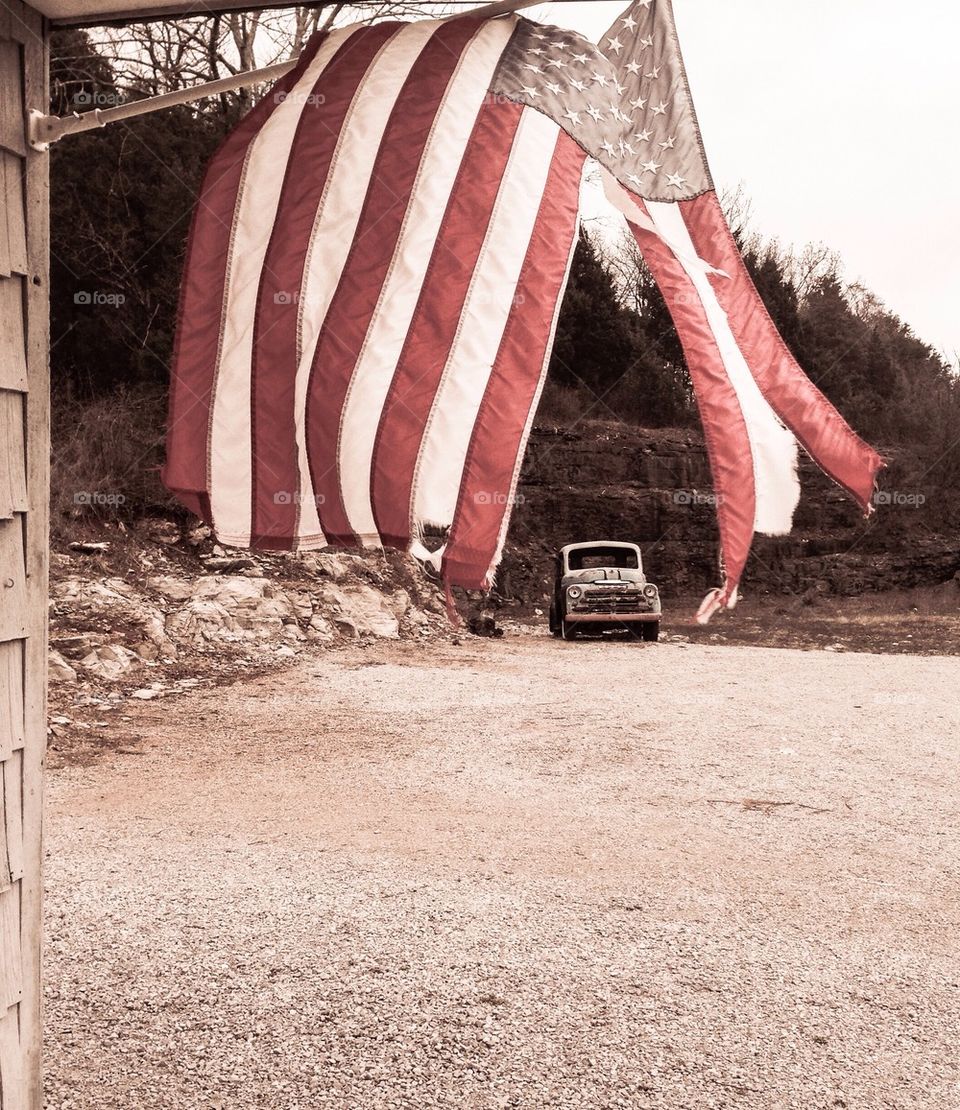 Vintage old truck and American flag