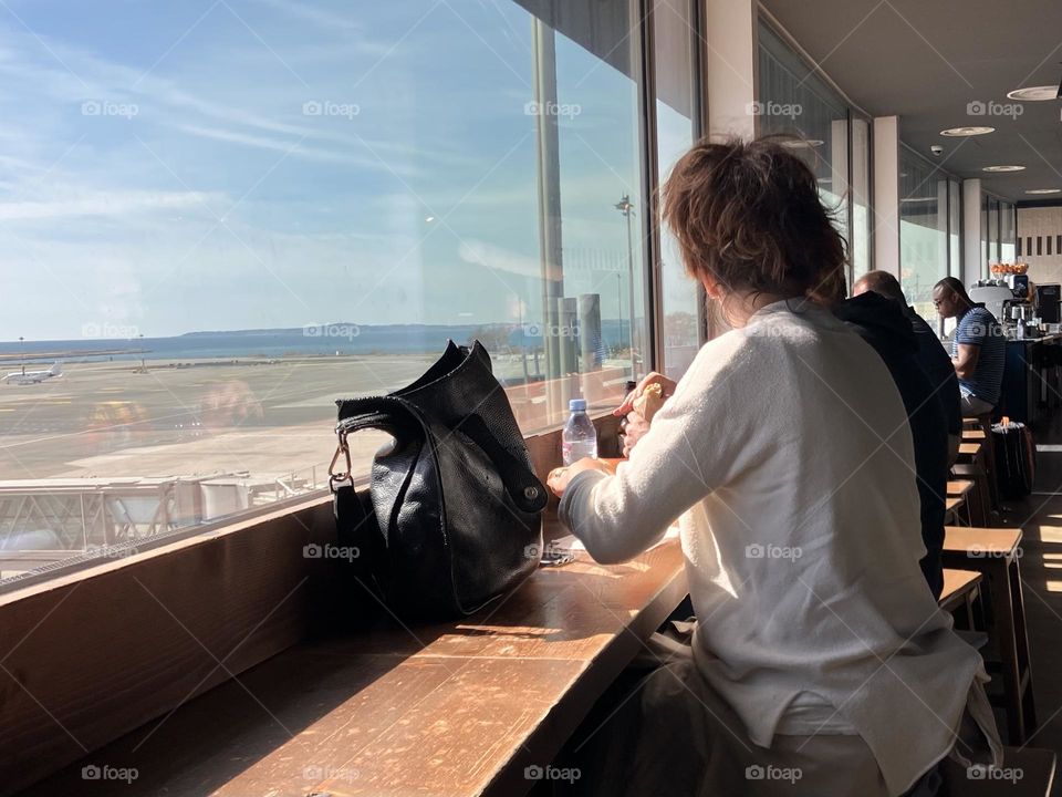 Woman in sunny window 