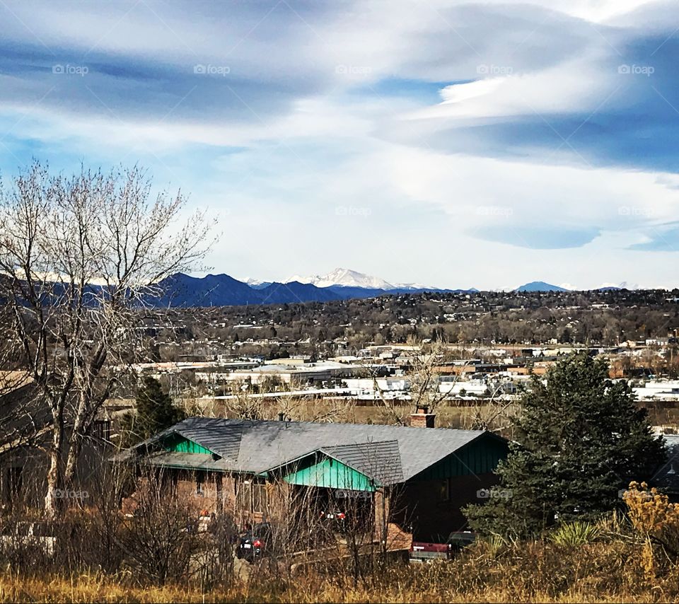A view of the Rocky Mountain range from a hill in Denver, Colorado.