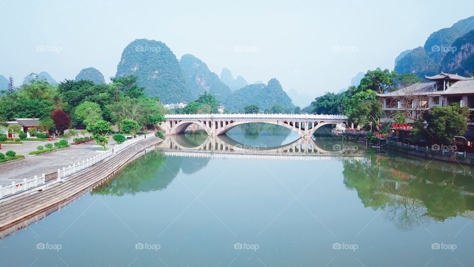 Beautiful bridge in Yangshuo, in Guilin, China. I love the way it reflects in the water.