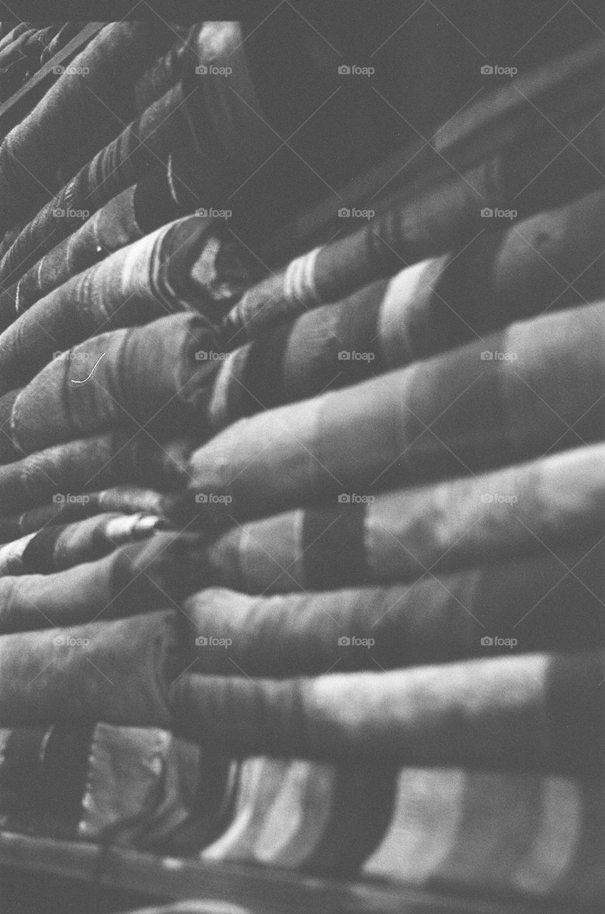 Sheets piled sky high, Moroccan market stall
