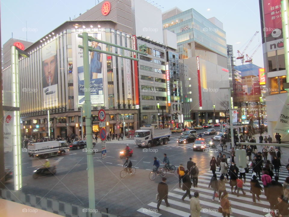 Ginza, Tokyo, Japan. Street Crossing with Traffic and Buildings.