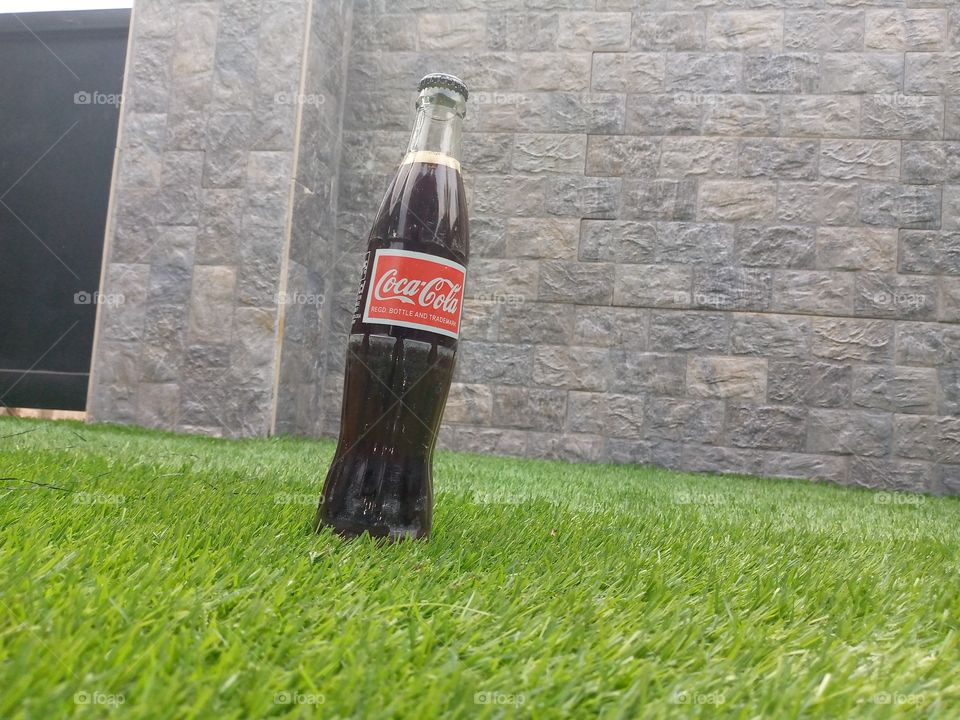 I need money to buy good camera to run a good work, so I celebrate with Coca-Cola to stand a chance of winning