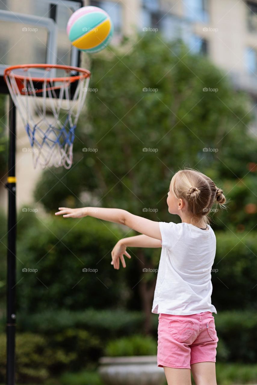 Girl playing basketball 