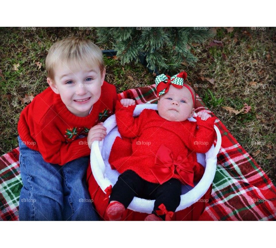 Baby girl with her smiling brother