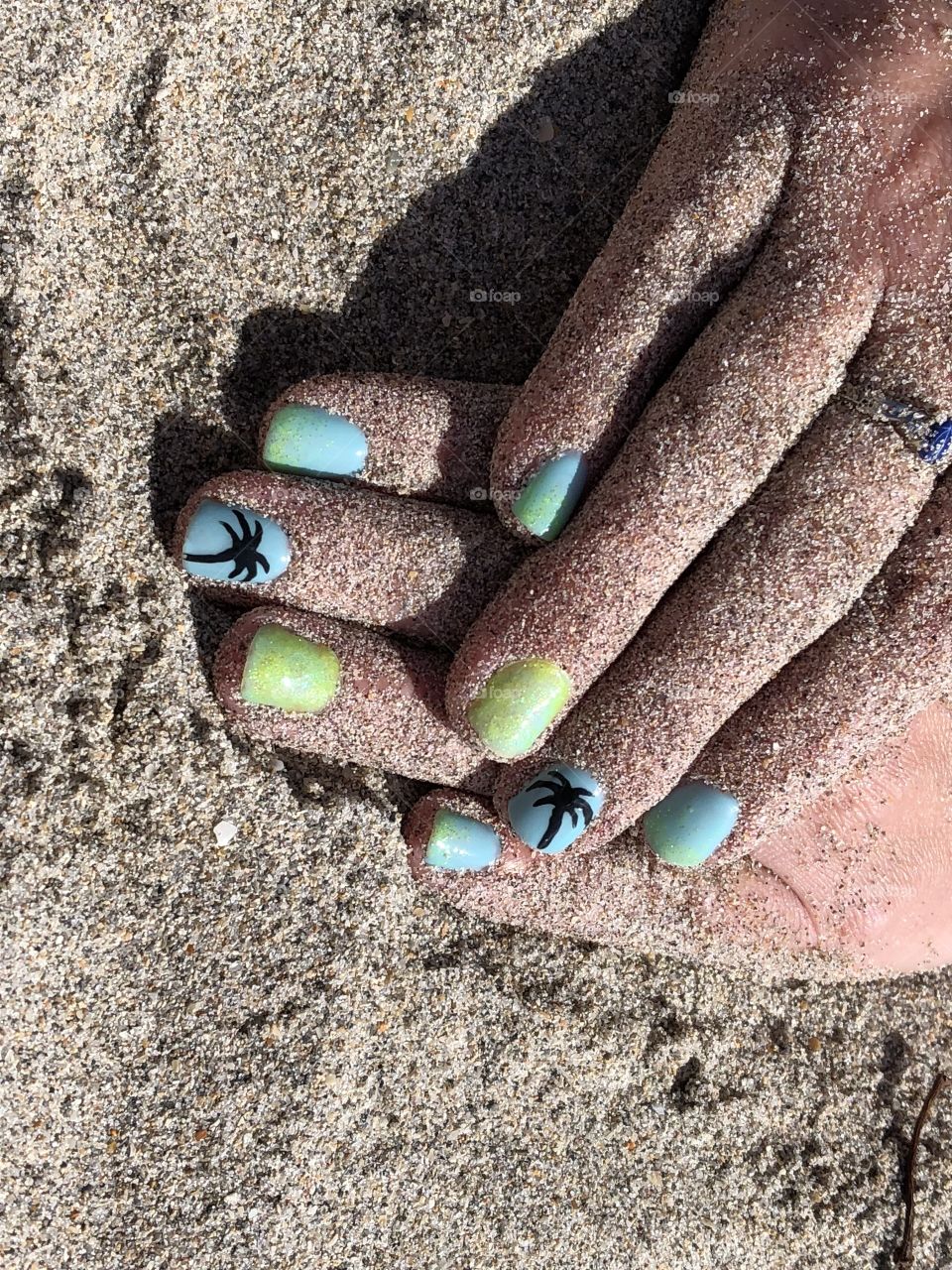 Beach finger nails in the sun. Can’t decide which is better. 