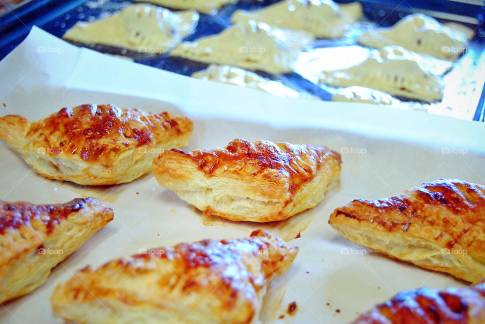 homemade glazed guava cheese strudel after baking, middle focus, uncooked or prepared blurred at background before