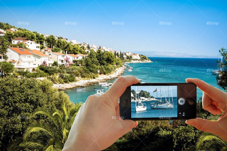 Smartphone with Croatian coast