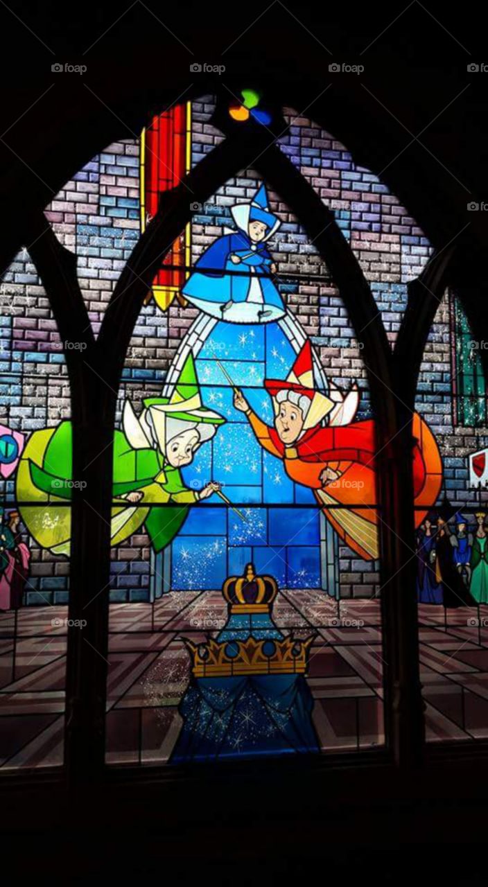 Disney land Paris / Euro Disneys 

one of Sleeping beauty castles 
stain glass window


(series available  )

Sleeping Beauty Castle is the fairy tale structure castle at the center of Disneyland Park, Hong Kong Disneyland and Disneyland Paris. It is based on the late-19th century Neuschwanstein Castle in Bavaria, Germany,with some French inspirations (especially Notre Dame de Paris and the Hospices de Beaune).