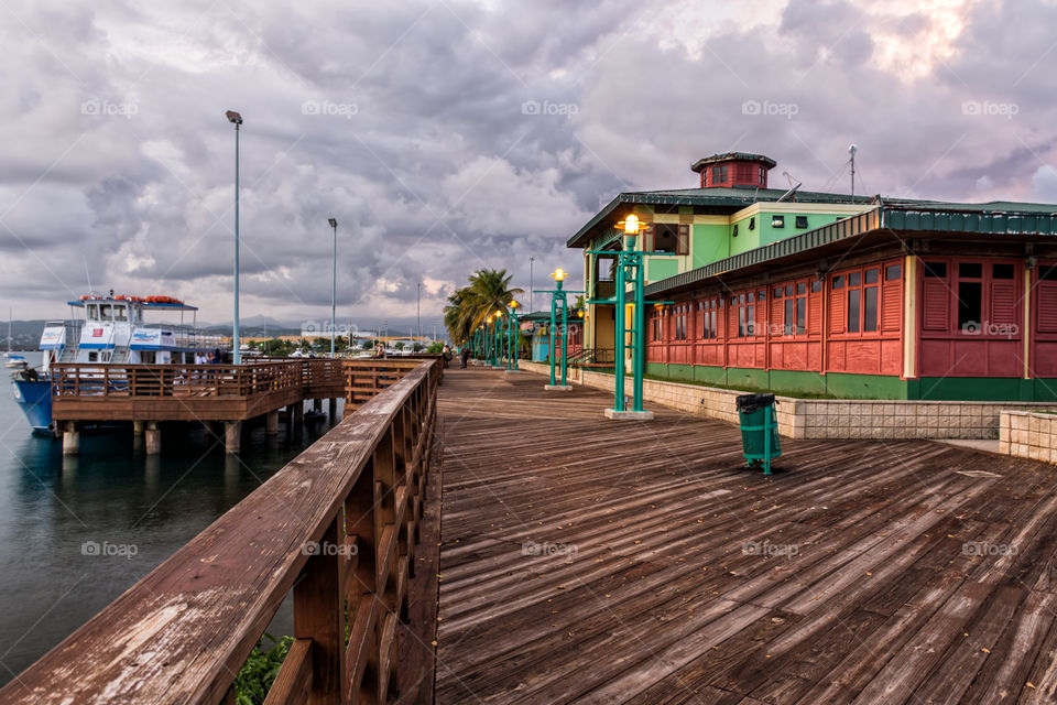 sunset at a boardwalk harbor