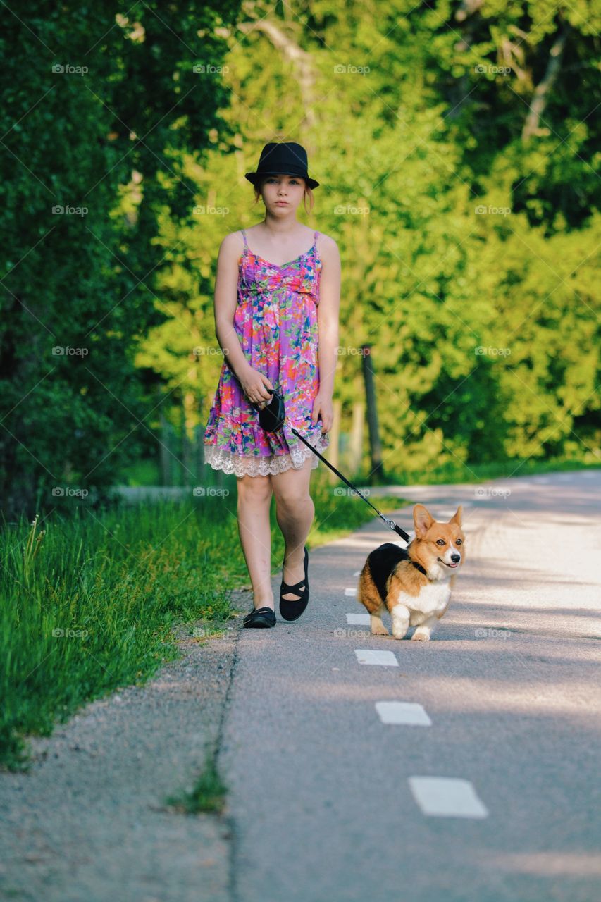 Girl walking her dog