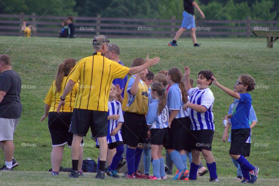 Children player and coach in the playground