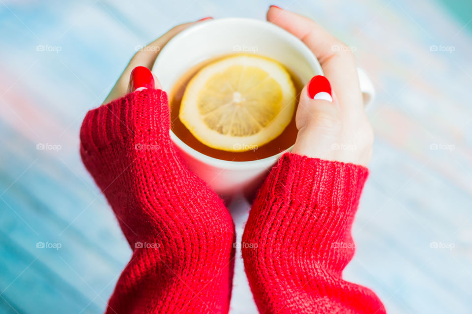 woman hand with cup of tea