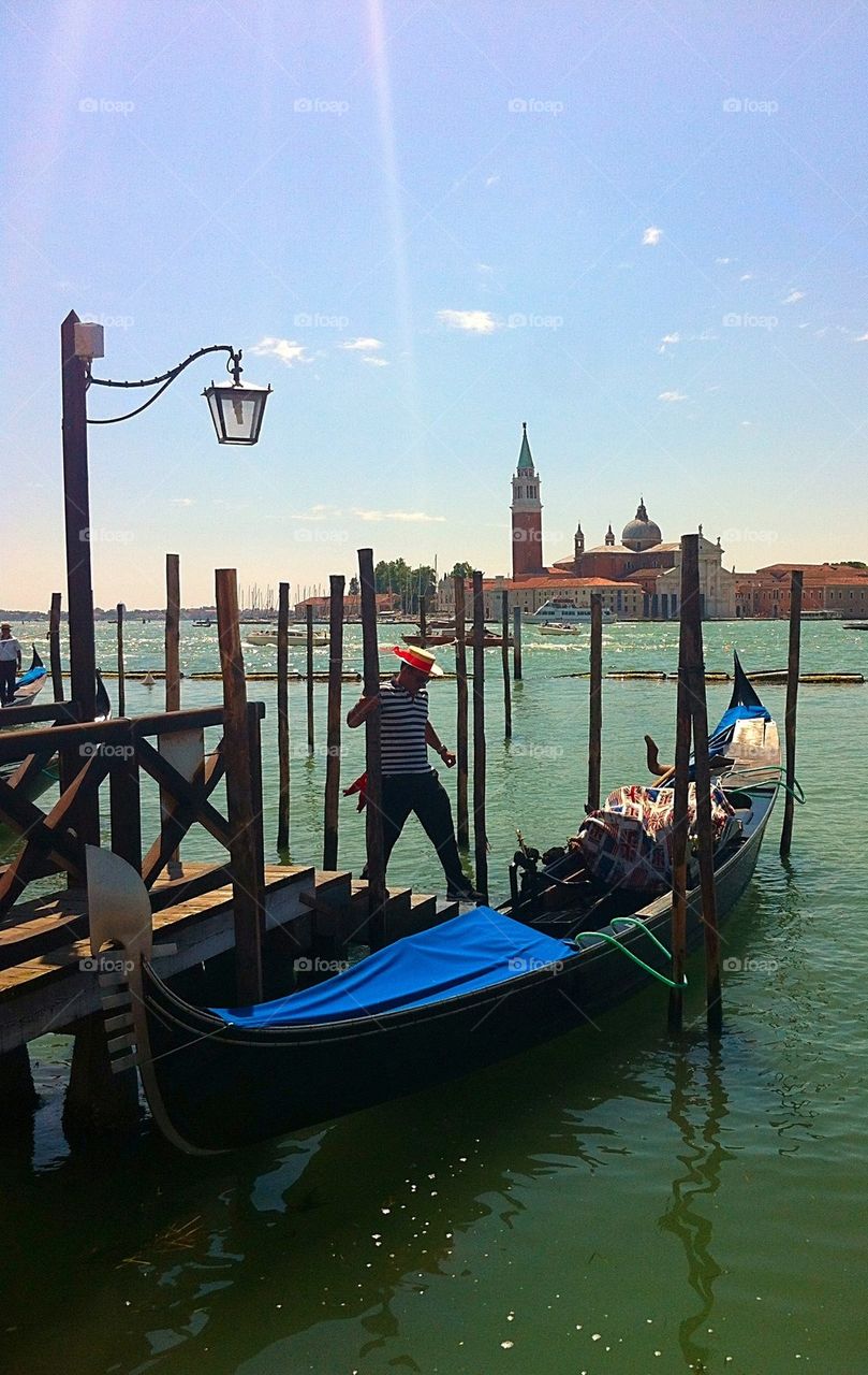 Gondolier boarding his boat