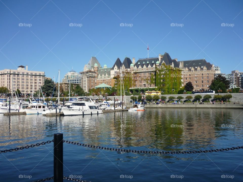 A view of the Empress Hotel in Victoria, British Columbia from the harbour. The ivy climbing up the side of the building is a great contrast to the clear skies.