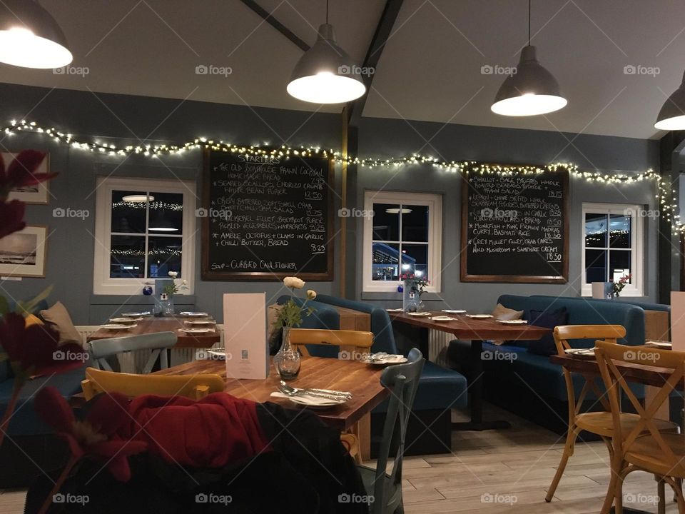 Interior at night of a little fish shack cafe … love the fairy lights and blue hue’s 