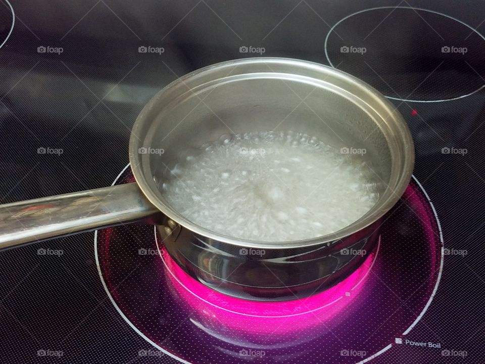 rolling boil on a hot stove, sugar water
