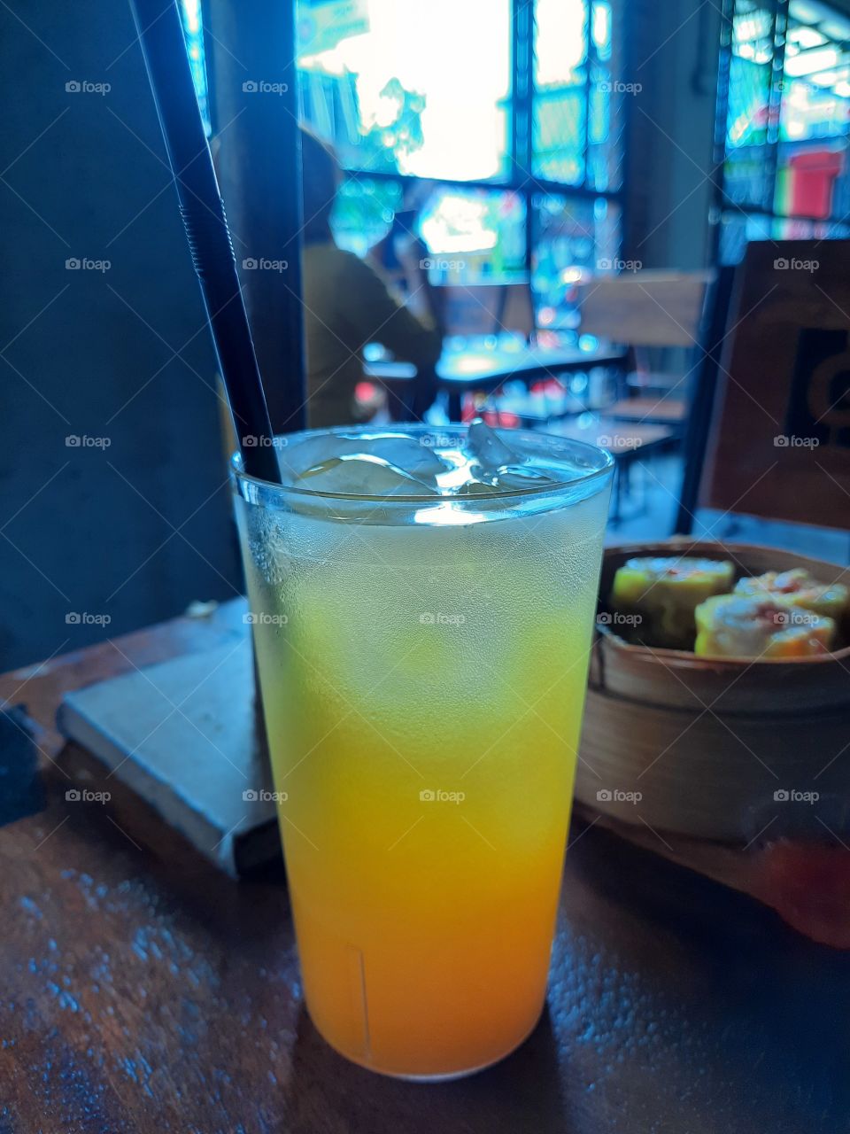 drink a glass of orange juice after eat. so fresh on the table.