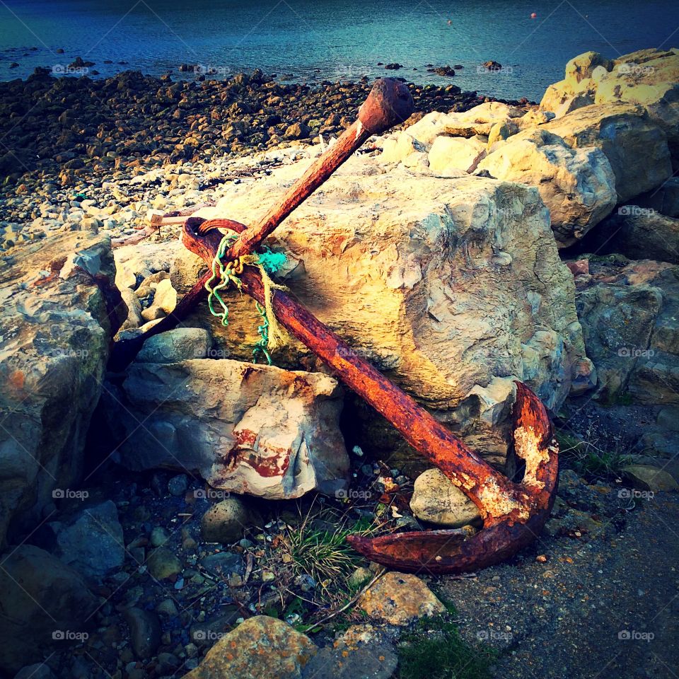 Rusty old abandoned anchor