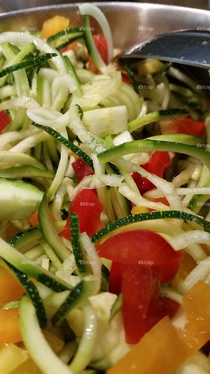 Zucchini Spaghetti with bell peppers, avocado, turkey sausage, and olive oil