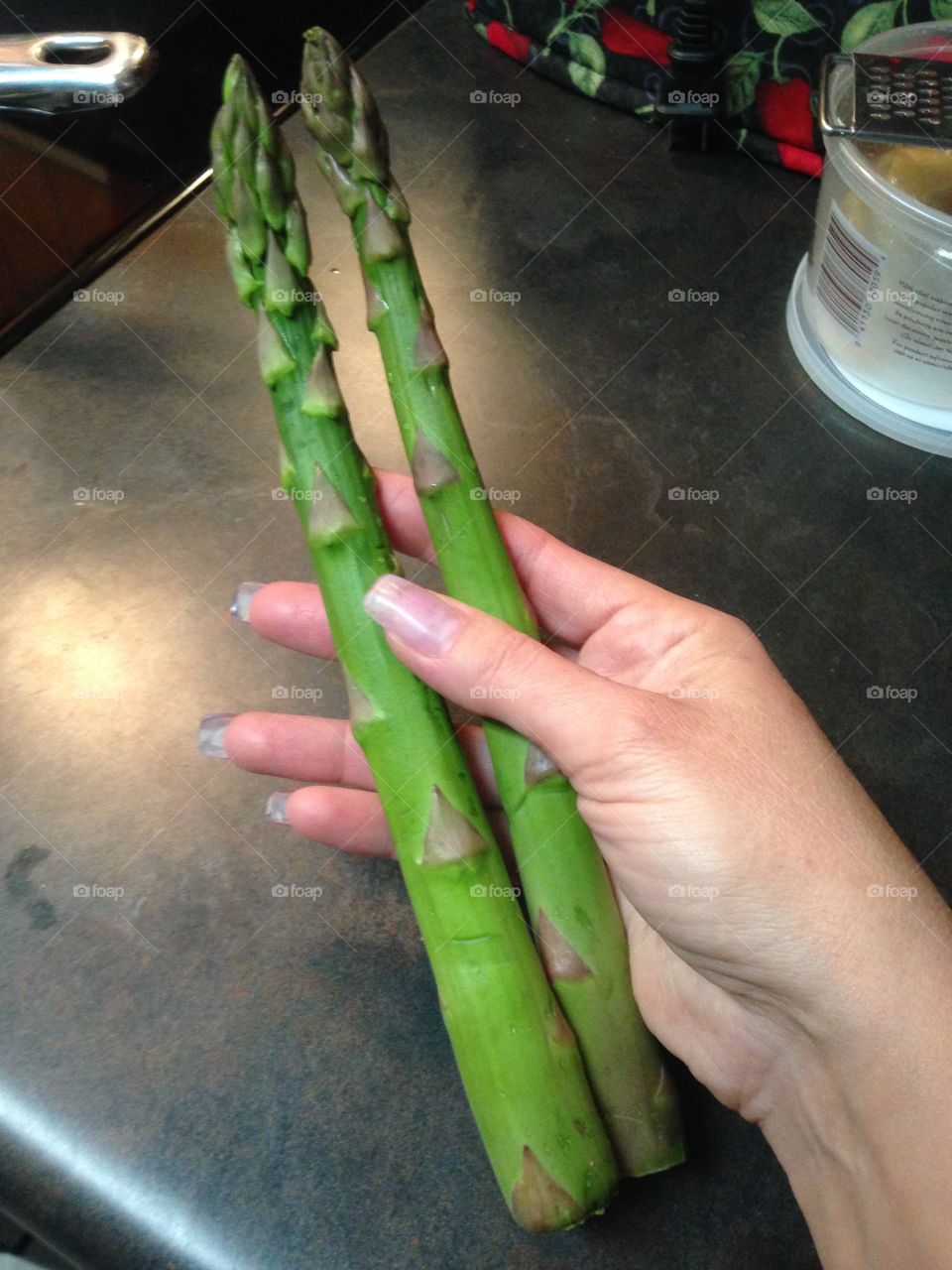 Large asparagus in hand