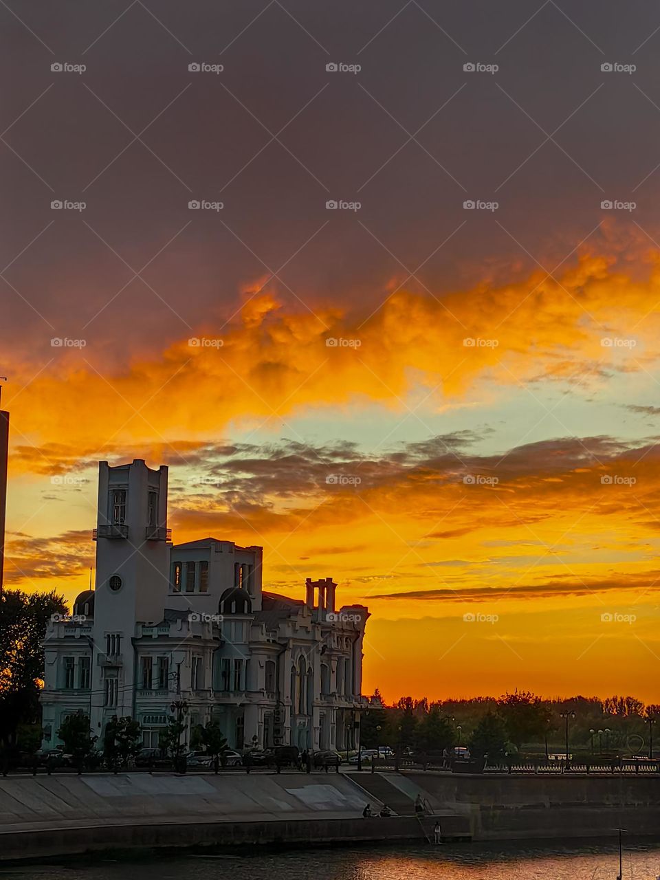 The river embankment at sunset