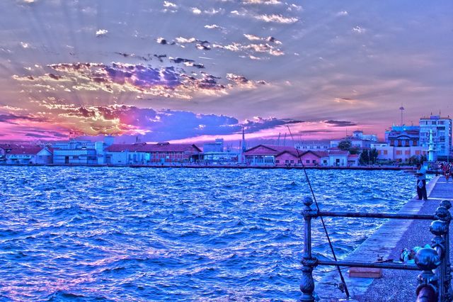 clouds sun greece fisherman by jnen