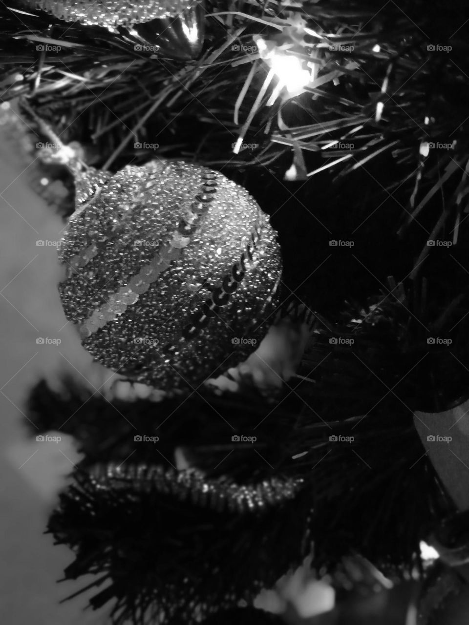 silvery Christmas ball decorated with sequins.