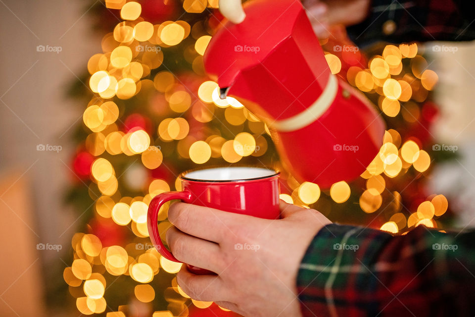 cup of coffee in a cozy festive Christmas atmosphere