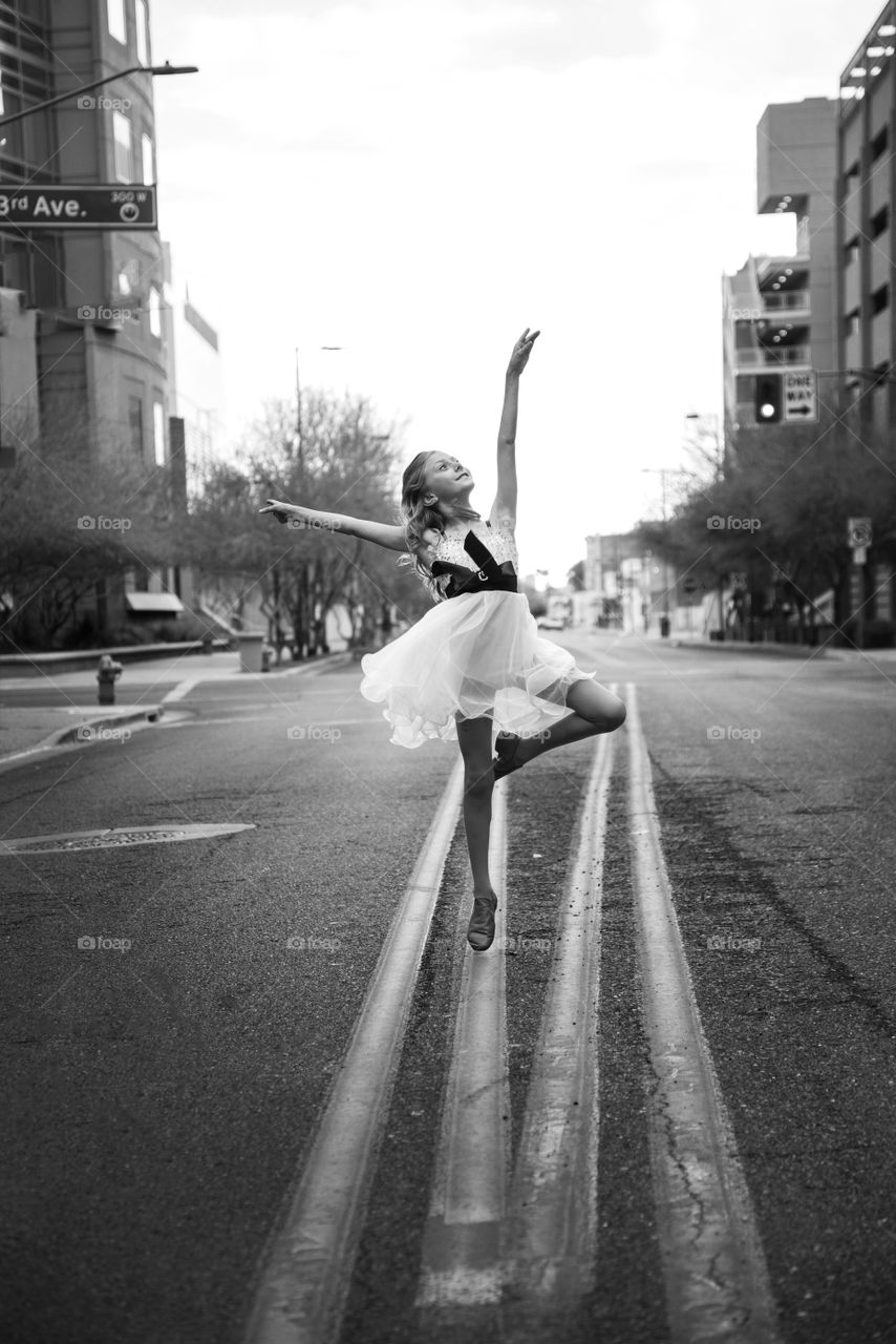 Ballet dancer posing at street