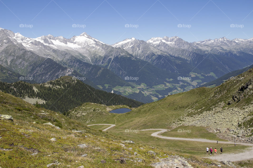 Hiking trail in the mountains  at high altitude, view of mountain peaks 