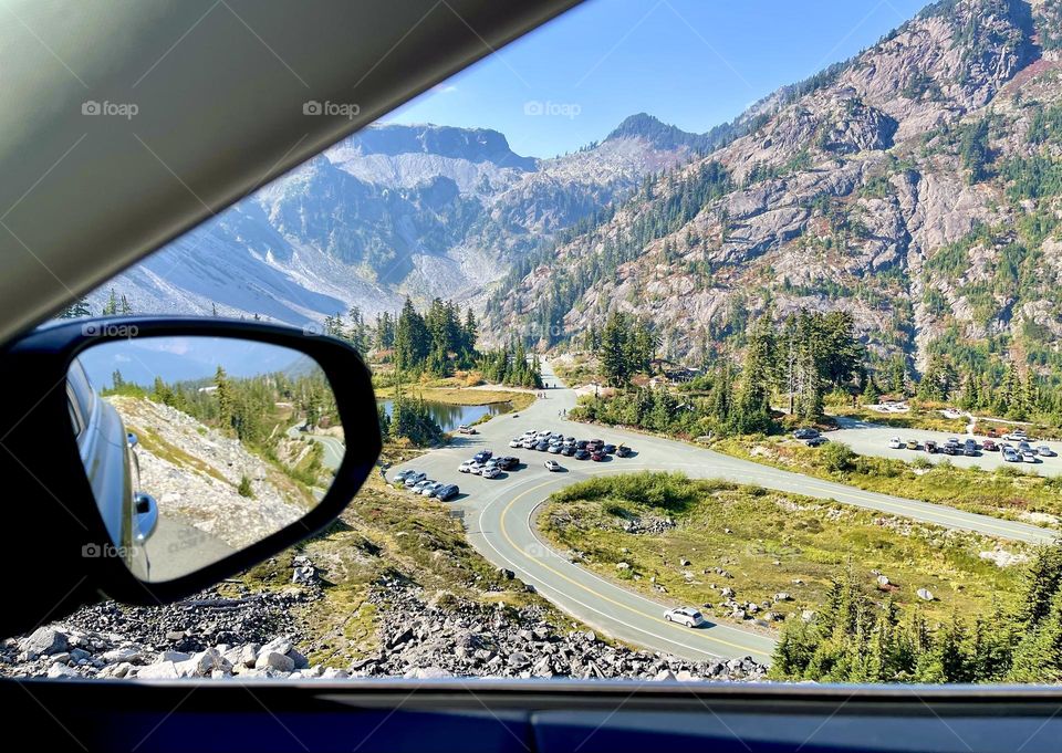 Mountain landscape in the car mirror 