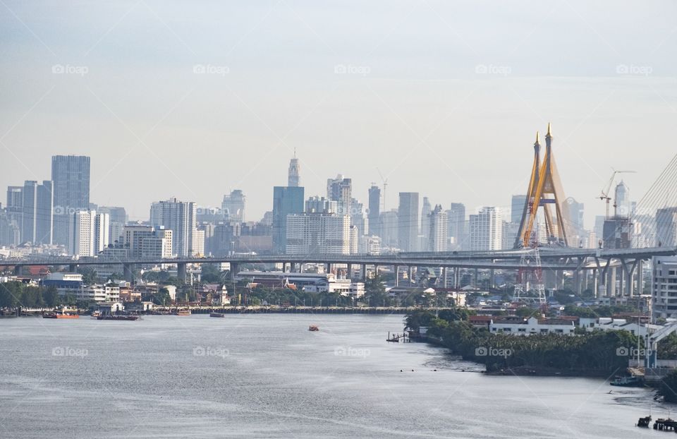 Beautiful river leading line pass through skyscraper in Bangkok Thailand  