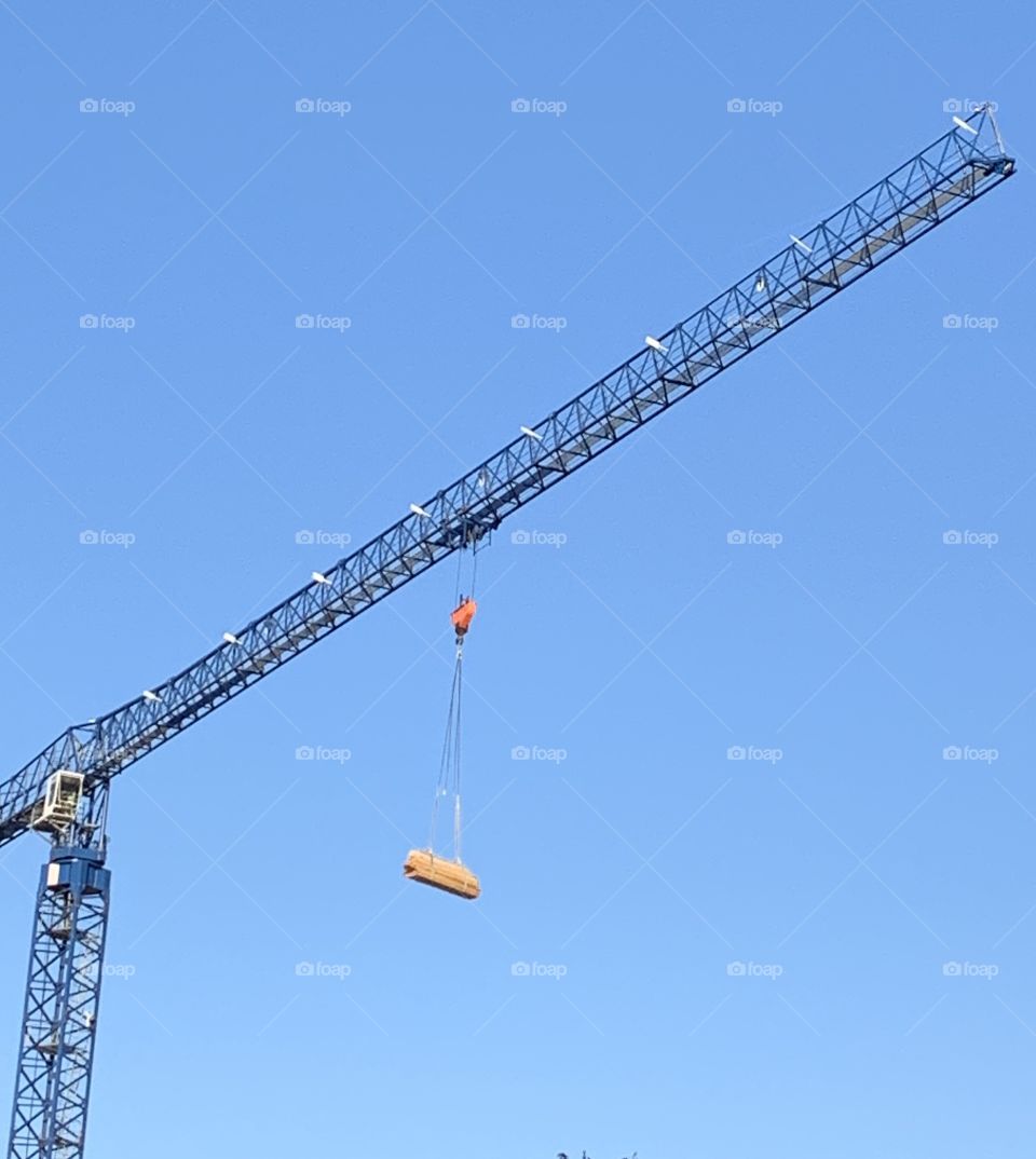 A crane working on building a parking garage