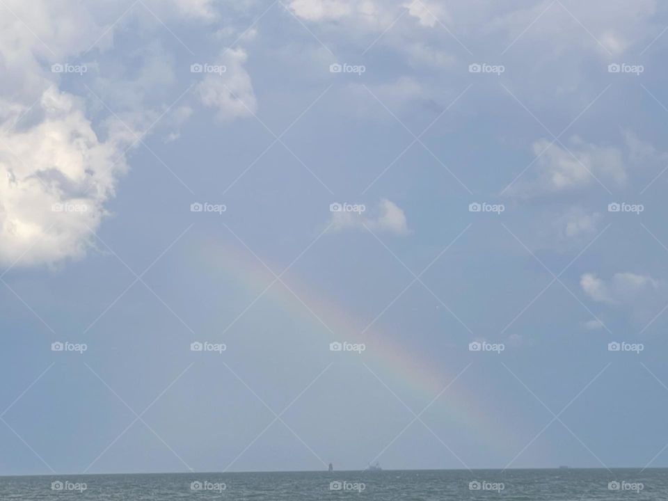 Rainbow over ocean