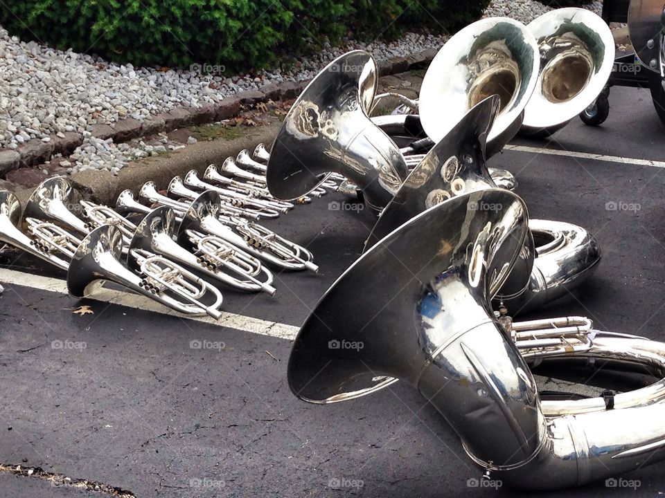 Silver instruments . I was at a band competition when I saw all of the instruments lying on the ground. 