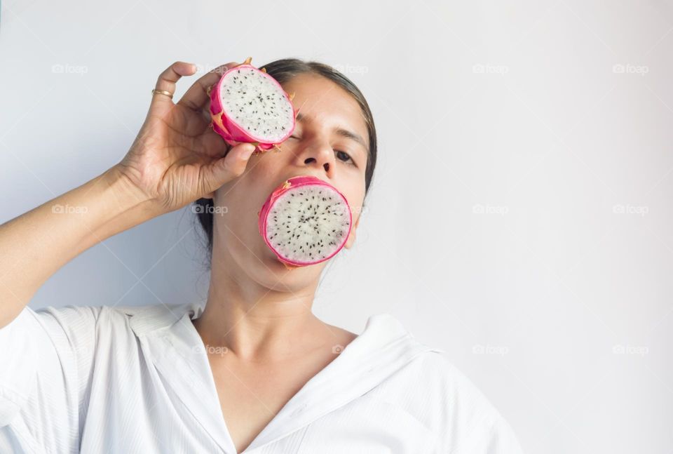 Circle shaped dragon fruit halves.