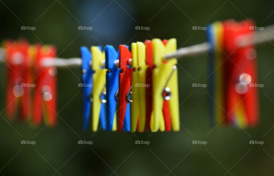 Colourful pegs on the line. Colourful pegs on the line