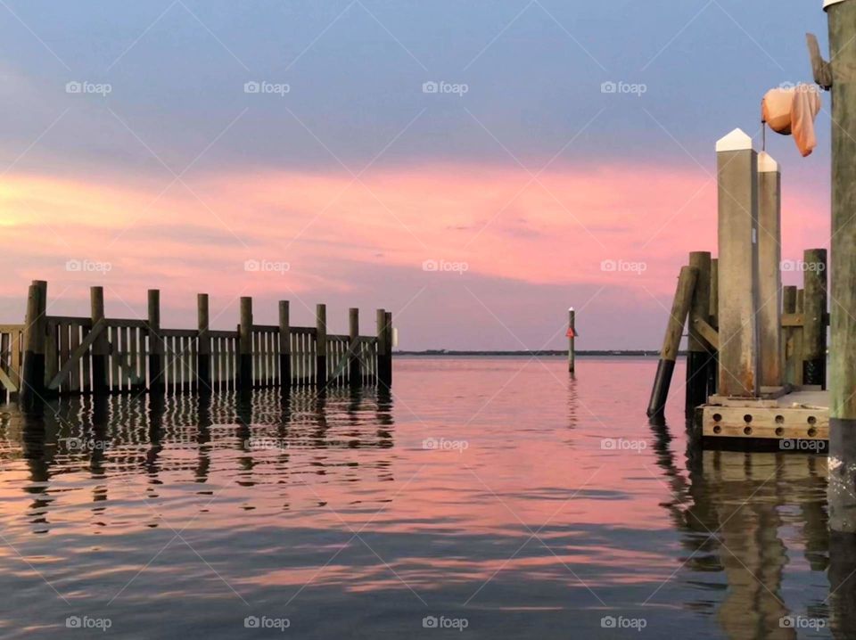 dreamy sunset casting a beautiful reflection off the water in florida