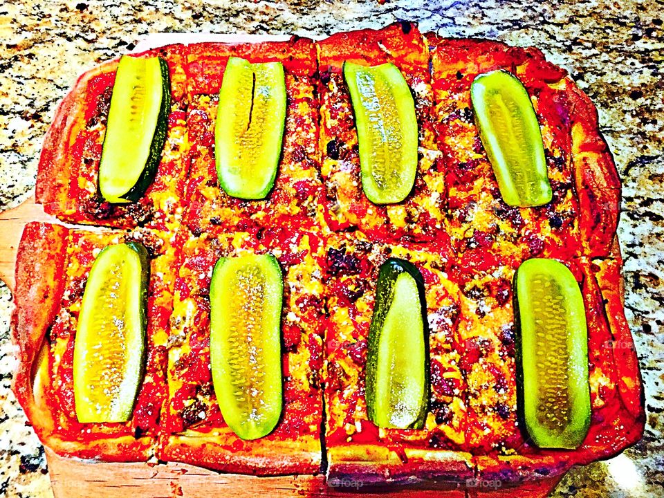 Cheeseburger Pizza  made with pizza sauce, mozzarella, ground beef, shredded American cheese and spices. Garnish with sliced dill pickles after baking!!  So good!! 