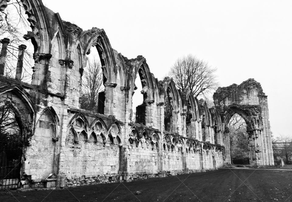 Black and white view of remains of an Abbey in York on an overcast day