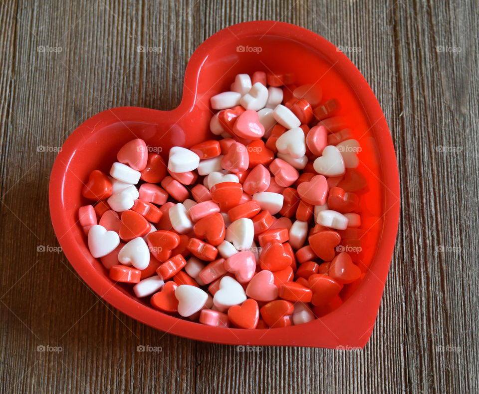 Heart shaped dish full of Valentines candy