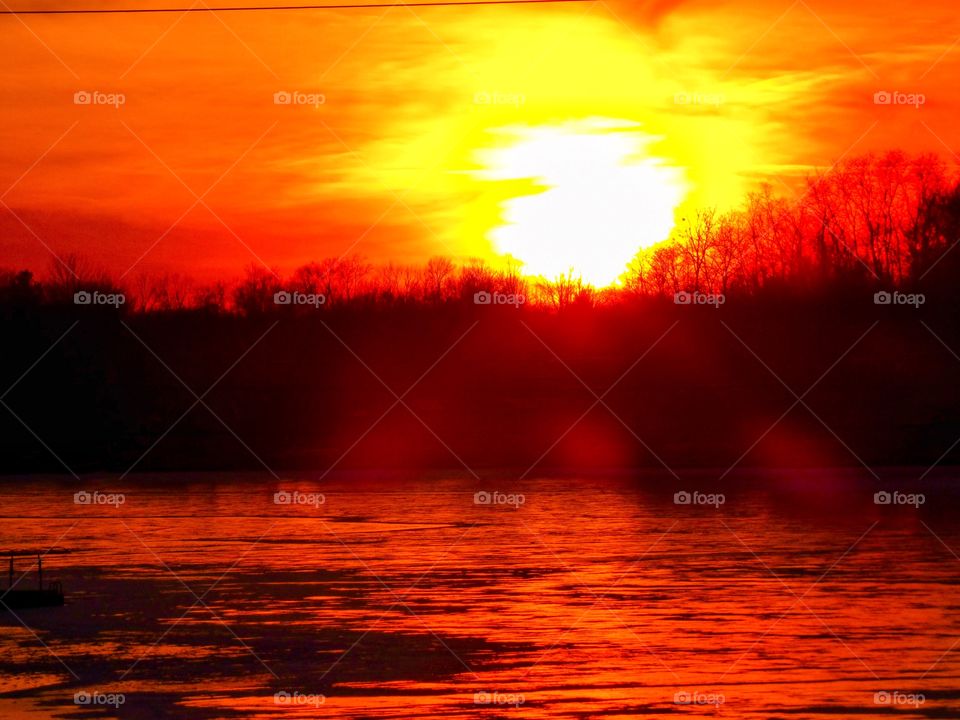 Beautiful sunset over the frozen Indiana lake