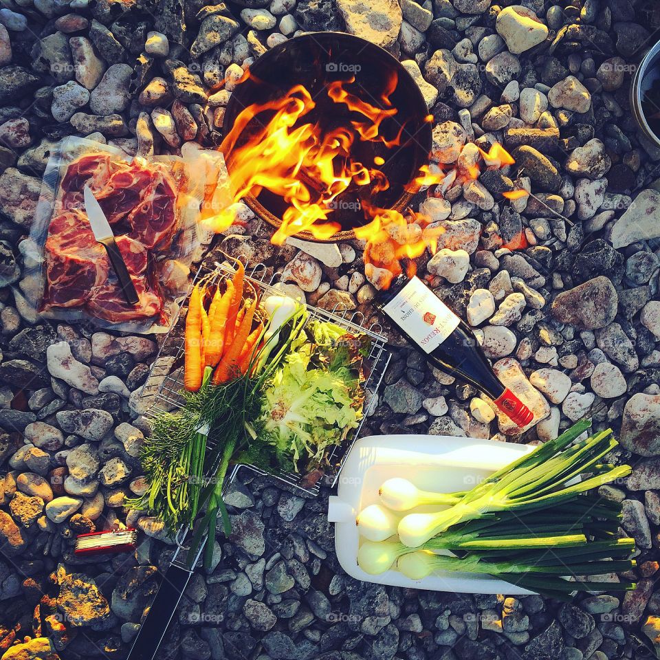 Outdoor cooking with local lamb meat organic vegetables on the fire