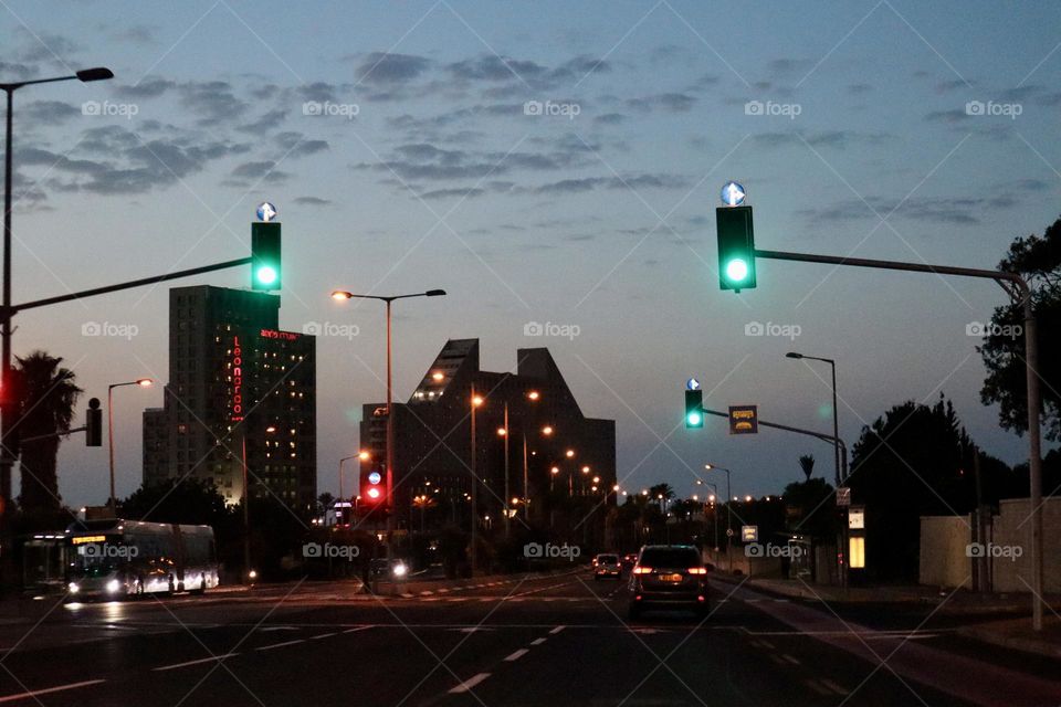 Twinkling windows and road lights at evening 
